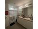 Bathroom with double vanity and shower at 3181 Serendipity Way, Davenport, FL 33896