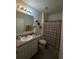 Bathroom with single vanity and shower at 3181 Serendipity Way, Davenport, FL 33896