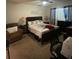 Bedroom with queen-size bed and sitting area at 3181 Serendipity Way, Davenport, FL 33896