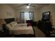 Primary bedroom with king-size bed and ensuite at 3181 Serendipity Way, Davenport, FL 33896