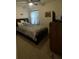 Cozy bedroom with double bed and window at 3181 Serendipity Way, Davenport, FL 33896
