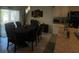 Dining area with a table for six and access to the backyard at 3181 Serendipity Way, Davenport, FL 33896