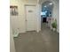 Spacious hallway with tile floors and a view of the kitchen at 3181 Serendipity Way, Davenport, FL 33896