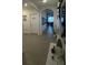 Bright and spacious hallway with tile flooring and access to laundry at 3181 Serendipity Way, Davenport, FL 33896