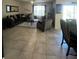 Spacious living room with tile floors and sectional sofa at 3181 Serendipity Way, Davenport, FL 33896