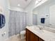 Bathroom with shower/tub combo, vanity, and neutral decor at 362 Via Torrente Dr, Kissimmee, FL 34759