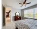 Bedroom with king-size bed, dresser, and access to hallway at 362 Via Torrente Dr, Kissimmee, FL 34759