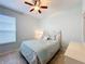 Bedroom with a queen-size bed, nightstand and window at 362 Via Torrente Dr, Kissimmee, FL 34759