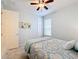 Bedroom with dresser, ceiling fan and ensuite at 362 Via Torrente Dr, Kissimmee, FL 34759