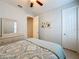 Bedroom with dresser, ceiling fan, and ensuite access at 362 Via Torrente Dr, Kissimmee, FL 34759