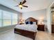 Well-lit bedroom featuring a king-size bed and en-suite bathroom at 362 Via Torrente Dr, Kissimmee, FL 34759
