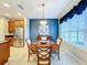 Dining area with table and chairs, open to kitchen at 362 Via Torrente Dr, Kissimmee, FL 34759