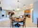 Bright dining area with round table and four chairs at 362 Via Torrente Dr, Kissimmee, FL 34759