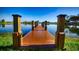 Serene wooden dock extending over calm lake water at 362 Via Torrente Dr, Kissimmee, FL 34759