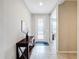 Front entry with dark wood console table and white walls at 362 Via Torrente Dr, Kissimmee, FL 34759