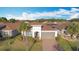 House exterior view with brown roof and palm trees at 362 Via Torrente Dr, Kissimmee, FL 34759