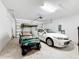 Garage with golf cart and car, plus overhead storage at 362 Via Torrente Dr, Kissimmee, FL 34759