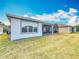 House exterior with a screened patio and well-maintained lawn at 362 Via Torrente Dr, Kissimmee, FL 34759