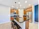 Kitchen island with seating and stainless steel appliances at 362 Via Torrente Dr, Kissimmee, FL 34759