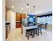 Modern kitchen with island, breakfast bar and stainless steel appliances at 362 Via Torrente Dr, Kissimmee, FL 34759