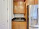 Kitchen corner with wood cabinets and granite countertop at 362 Via Torrente Dr, Kissimmee, FL 34759