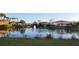Peaceful lake view with bridge and community buildings at 362 Via Torrente Dr, Kissimmee, FL 34759