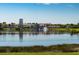 Tranquil lakefront view of community buildings at 362 Via Torrente Dr, Kissimmee, FL 34759