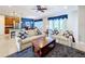 Living room with sectional sofa and view of kitchen at 362 Via Torrente Dr, Kissimmee, FL 34759