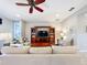 Spacious living room with sectional sofa and ceiling fan at 362 Via Torrente Dr, Kissimmee, FL 34759