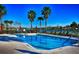 Inviting community pool with lake views and red umbrellas at 362 Via Torrente Dr, Kissimmee, FL 34759