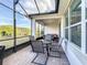 Enjoy this screened porch with patio furniture and view of the backyard at 362 Via Torrente Dr, Kissimmee, FL 34759