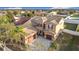 Overhead view of a Mediterranean-style home with a tile roof and well-manicured lawn at 3841 Golden Knot Dr, Kissimmee, FL 34746