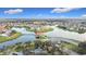 Aerial view of a waterfront community with interconnected waterways and community dock at 3841 Golden Knot Dr, Kissimmee, FL 34746