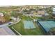Aerial view of community basketball and tennis courts with landscaped surroundings at 3841 Golden Knot Dr, Kissimmee, FL 34746