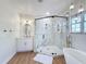 Stunning bathroom featuring a glass shower, soaking tub, and elegant fixtures at 3841 Golden Knot Dr, Kissimmee, FL 34746