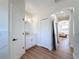 Bright bathroom with white vanity, mirror, and doorway leading to the bedroom at 3841 Golden Knot Dr, Kissimmee, FL 34746