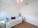 Bright bedroom with a daybed, a decorative ladder, and light hardwood floors at 3841 Golden Knot Dr, Kissimmee, FL 34746