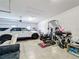 Spacious garage with room for a car, home gym, and storage at 3841 Golden Knot Dr, Kissimmee, FL 34746