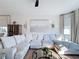 Comfortable living room featuring a large sectional sofa, modern decor, and a cozy atmosphere at 3841 Golden Knot Dr, Kissimmee, FL 34746