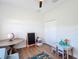 Bright room with a chalkboard, a toy storage basket, and a table with chairs for learning and play at 3841 Golden Knot Dr, Kissimmee, FL 34746