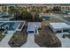 Aerial view of a house with a blue garage door and neighborhood at 386 Marion Oaks Trl, Ocala, FL 34473