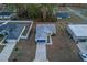 Aerial view of a house with a blue garage door and driveway at 386 Marion Oaks Trl, Ocala, FL 34473