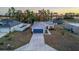 Aerial view of a house with a blue garage door at 386 Marion Oaks Trl, Ocala, FL 34473
