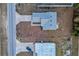 Aerial view of a single-story house with a driveway and yard at 386 Marion Oaks Trl, Ocala, FL 34473