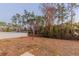 Backyard with a view of a treeline and privacy fence at 386 Marion Oaks Trl, Ocala, FL 34473