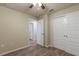 Bedroom with wood-look floors and double doors at 386 Marion Oaks Trl, Ocala, FL 34473