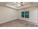 Spacious bedroom with ceiling fan and large window at 386 Marion Oaks Trl, Ocala, FL 34473