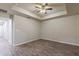Spacious bedroom with wood-look floors and ceiling fan at 386 Marion Oaks Trl, Ocala, FL 34473