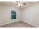 Bright bedroom with wood-look floors and a window at 386 Marion Oaks Trl, Ocala, FL 34473