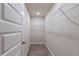 Walk-in closet with wire shelving and wood-look floors at 386 Marion Oaks Trl, Ocala, FL 34473